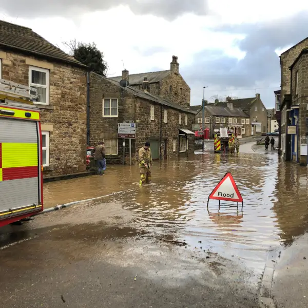 Flooded street in Masham Local Authority with Fire Engine and Flood Sign- Storm Ciara - BluWater Solutions