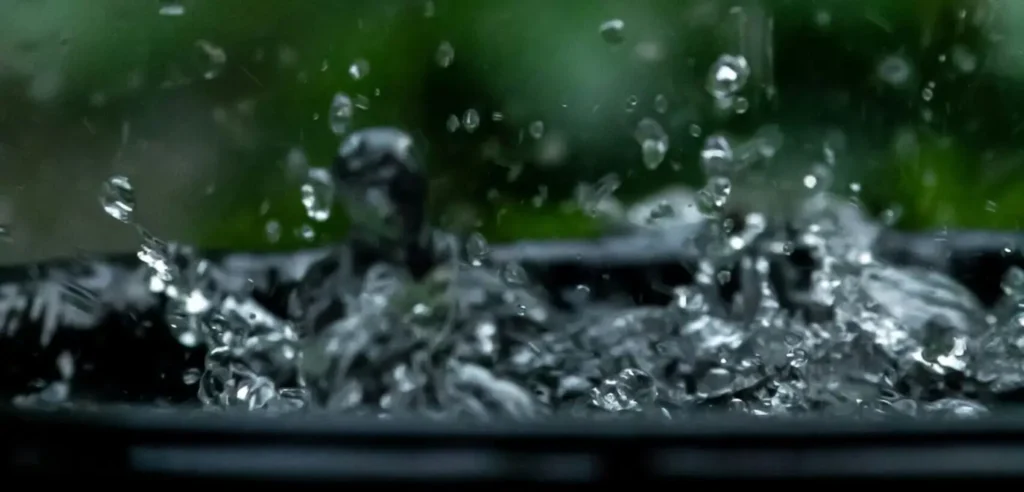 Splashing in a garden water butt